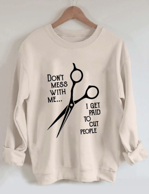 010724 Don't mess with me i get paid to cut people sweatshirt